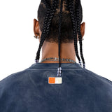 Rear view Male Model wearing a navy sweatshirt with the 'NY Tough' logo on the neck.