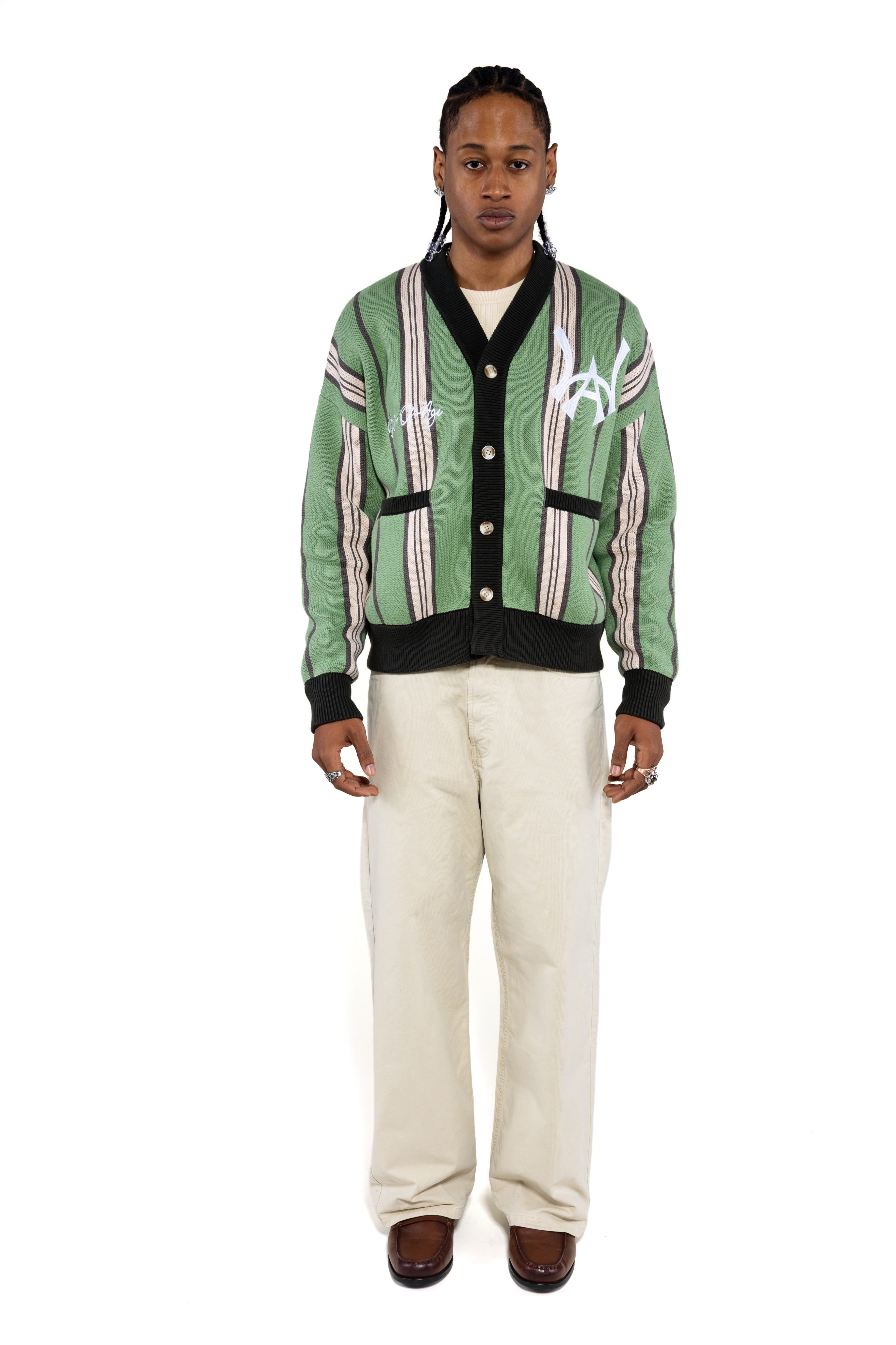 Male model wearing the WOA City cardigan mint on a white background