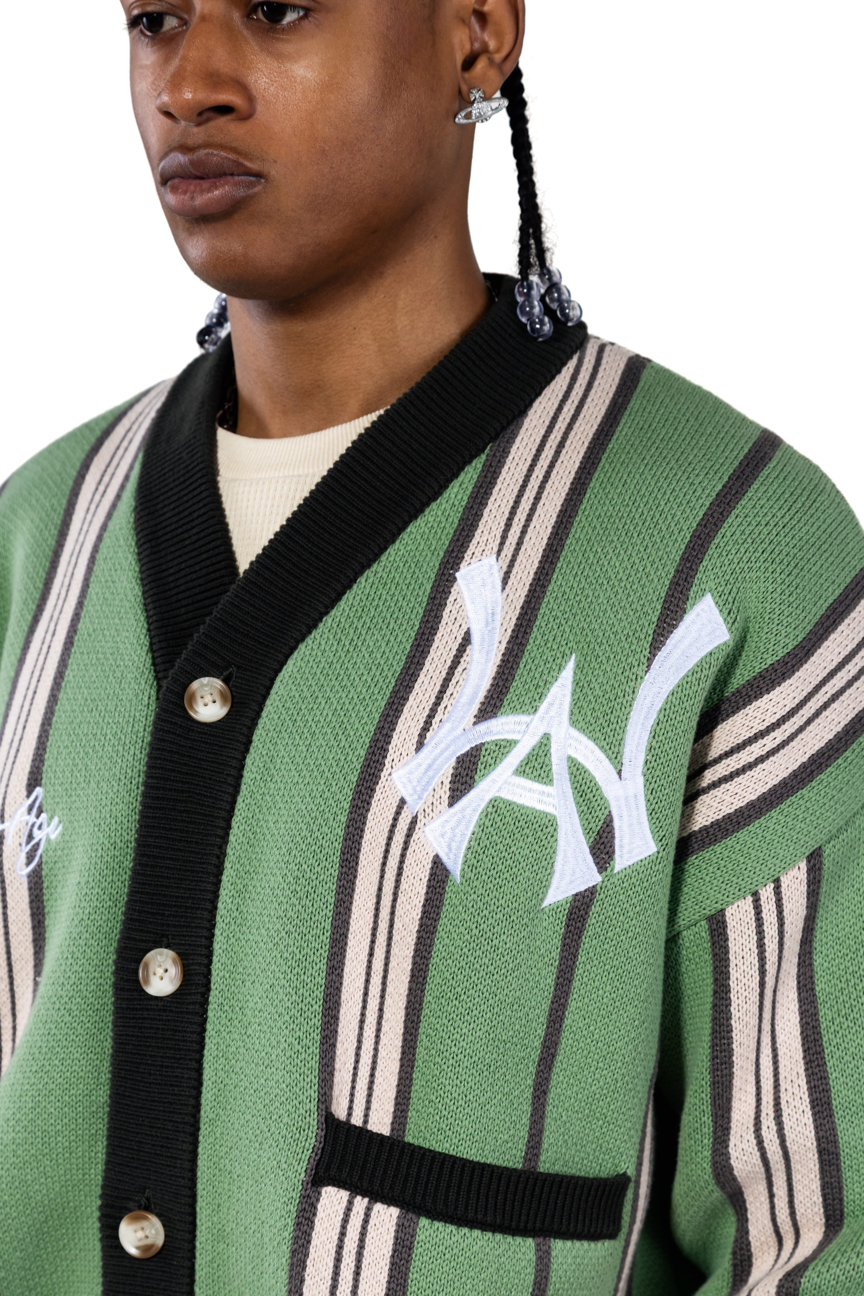 Close up of a Male model wearing the WOA City cardigan mint on a white background.'WA' Logo on the left chest