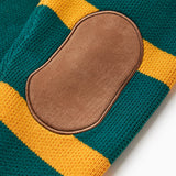 Close up of the brown suede elbow patches on the back of each sleeve of the WOA knit Rugby polo sweater.