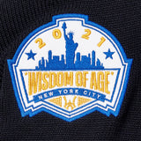 Patch with 'Wisdom of Age 2021 New York City' design on a black background