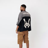 Rear View of Male Model wearing the WOA Football jersey V2 Slate on a white background