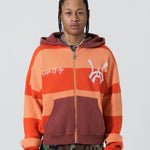 Front View Of A Male Model wearing The Wisdom Of Age Knit Hoodie Orange.