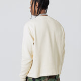 Rear view of a Male Model Wearing Cream Wisdom Of Age knit thermal