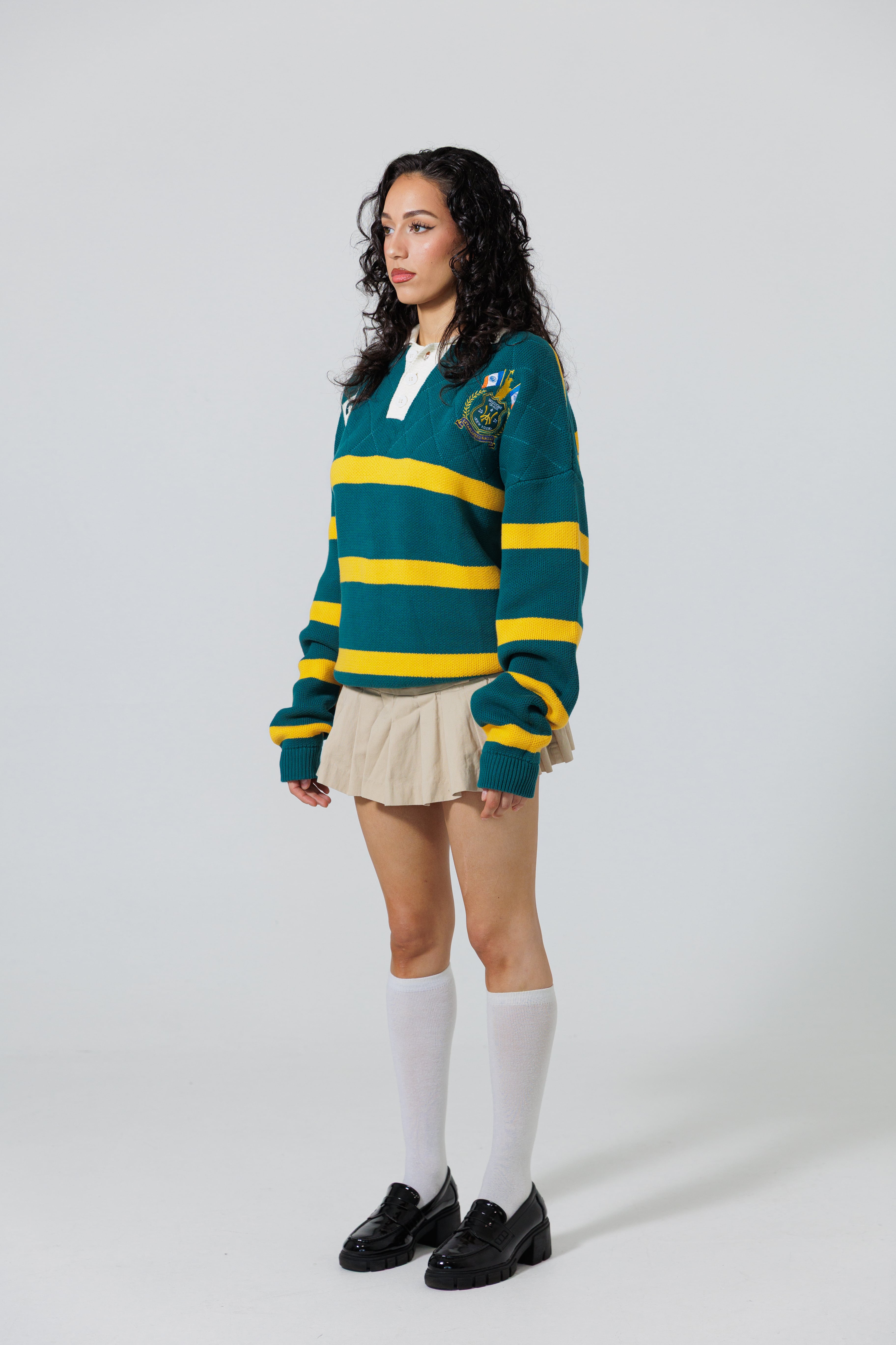 Full Body Front View Of A Female Model wearing The Wisdom Of Age Knit Rugby Sweater 