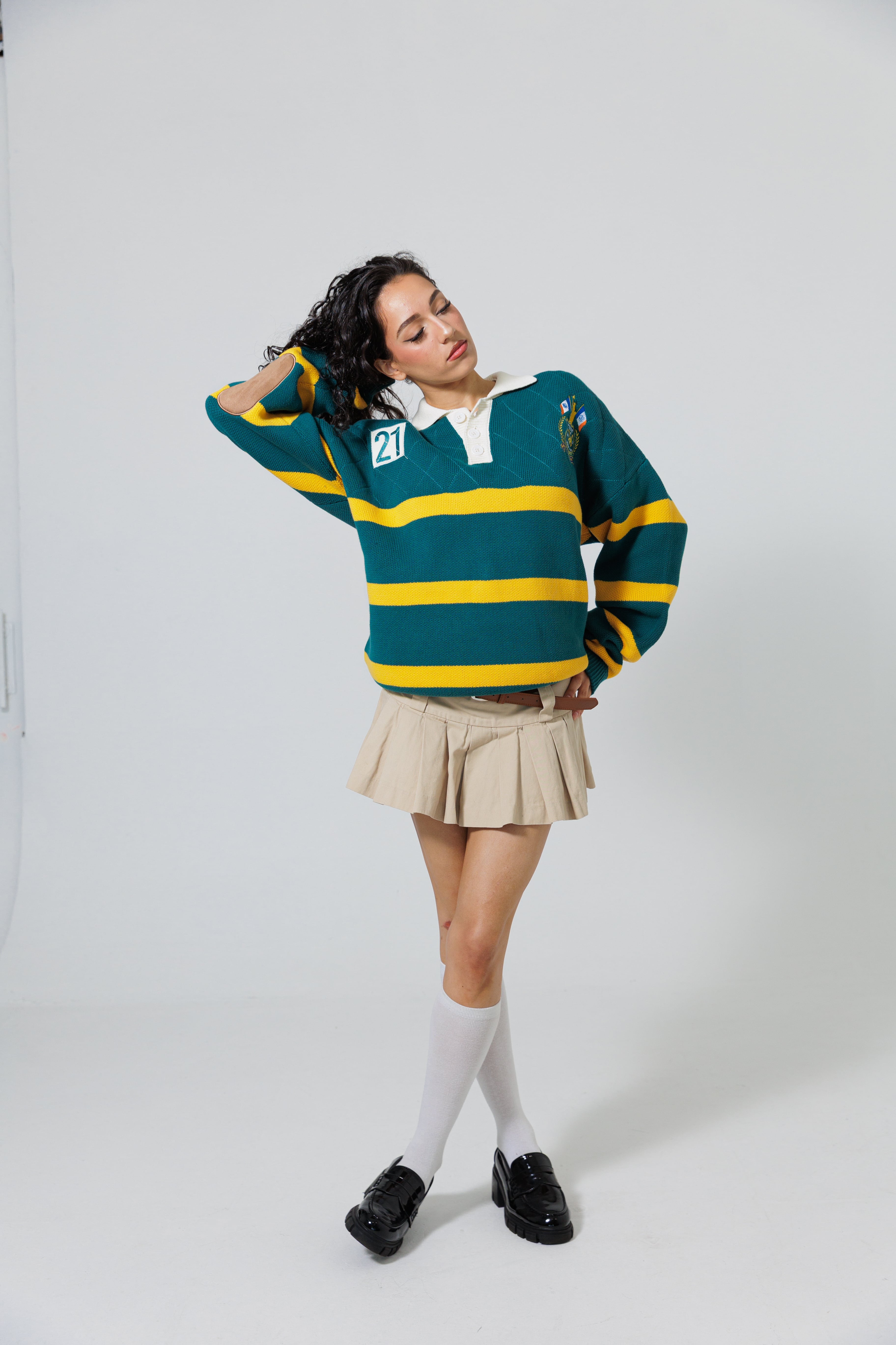 Full Body Front View Of A Female Model wearing The Wisdom Of Age Knit Rugby Sweater 