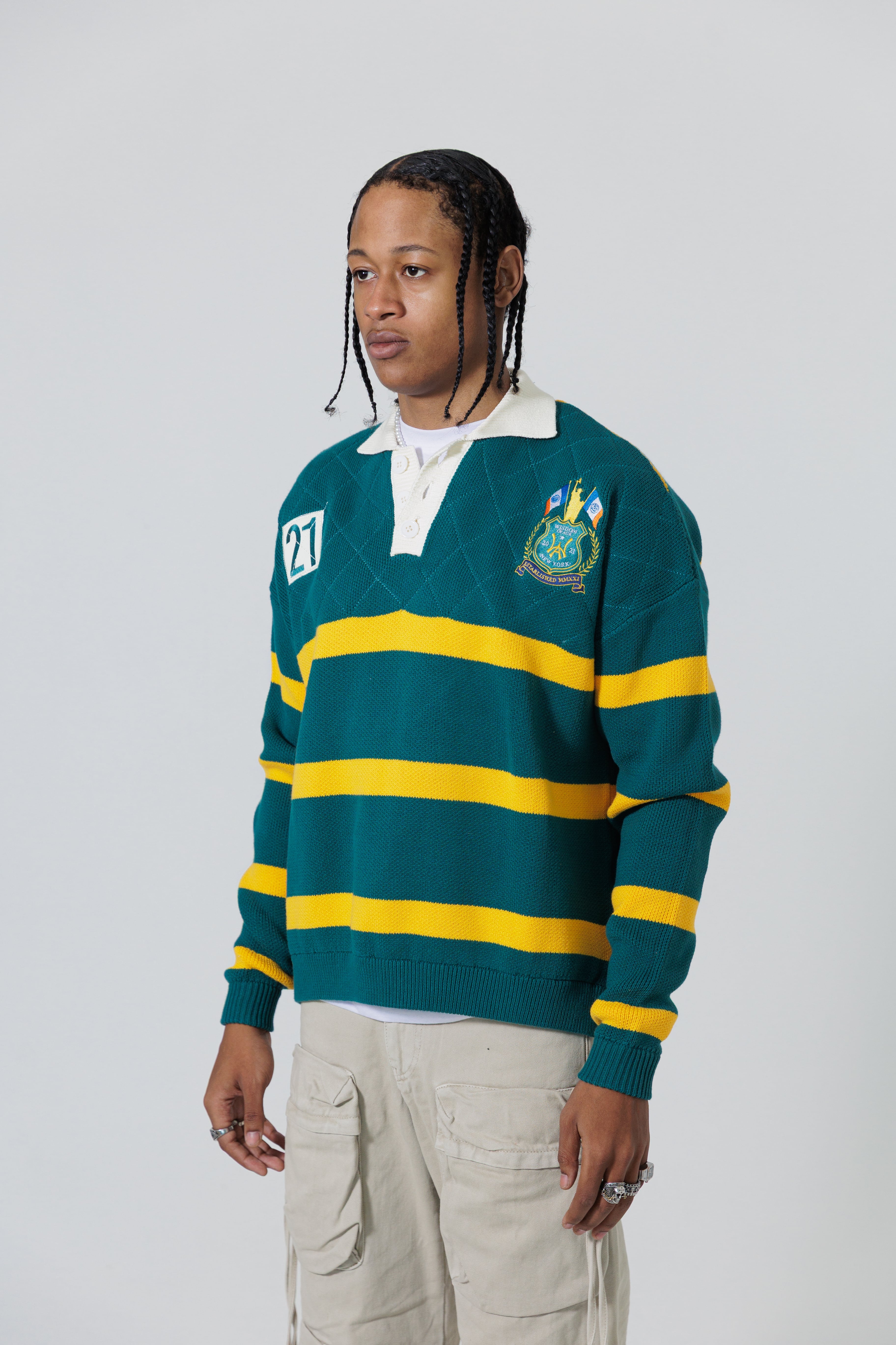 Front Side View Of A Male Model wearing The Wisdom Of Age Knit Rugby Sweater.