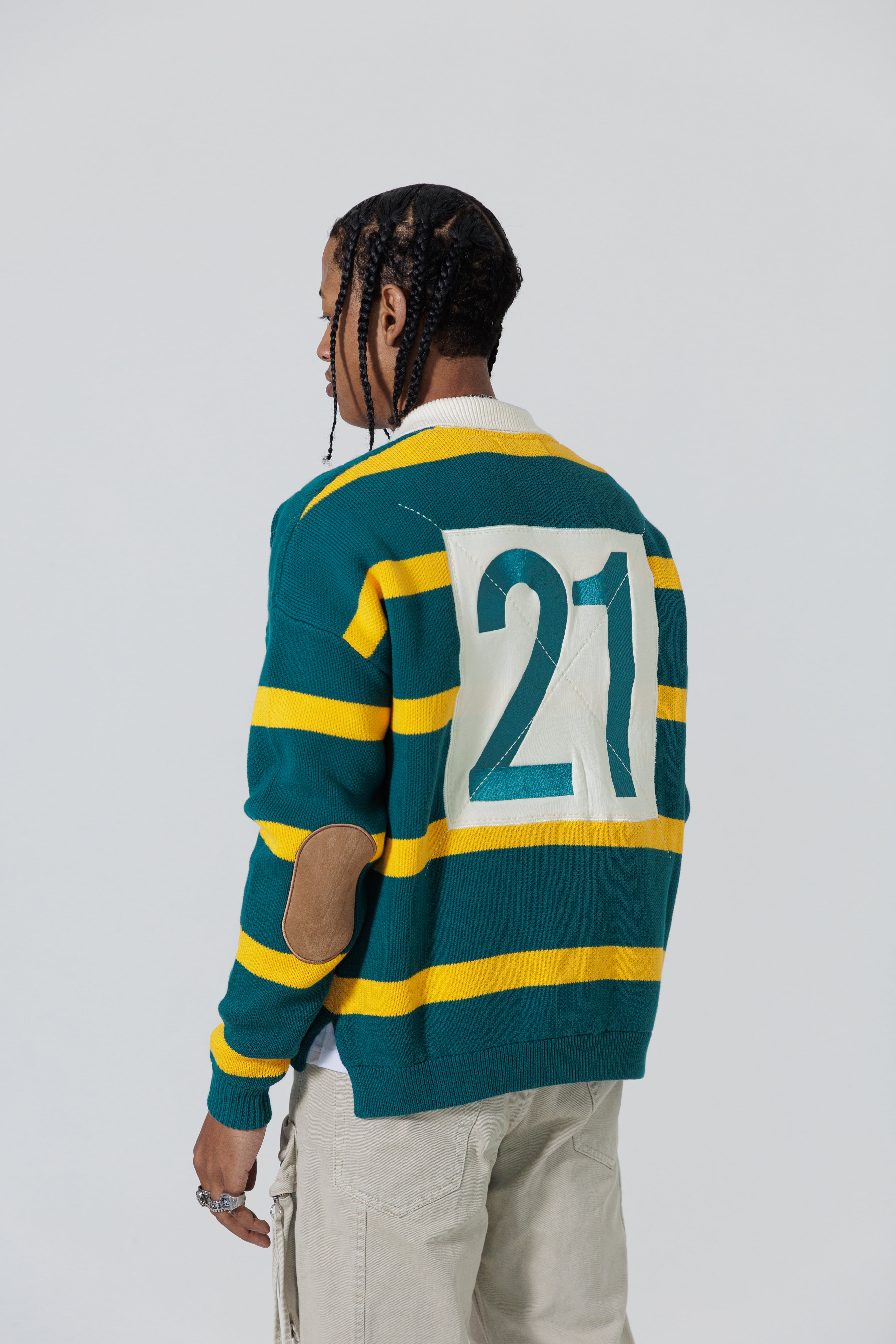 Rear View Of A Male Model wearing The Wisdom Of Age Knit Rugby Sweater.