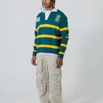 Full Body Front View Of A Male Model wearing The Wisdom Of Age Knit Rugby Sweater.