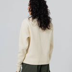 Rear view of a Female Model Wearing Cream Wisdom Of Age knit thermal