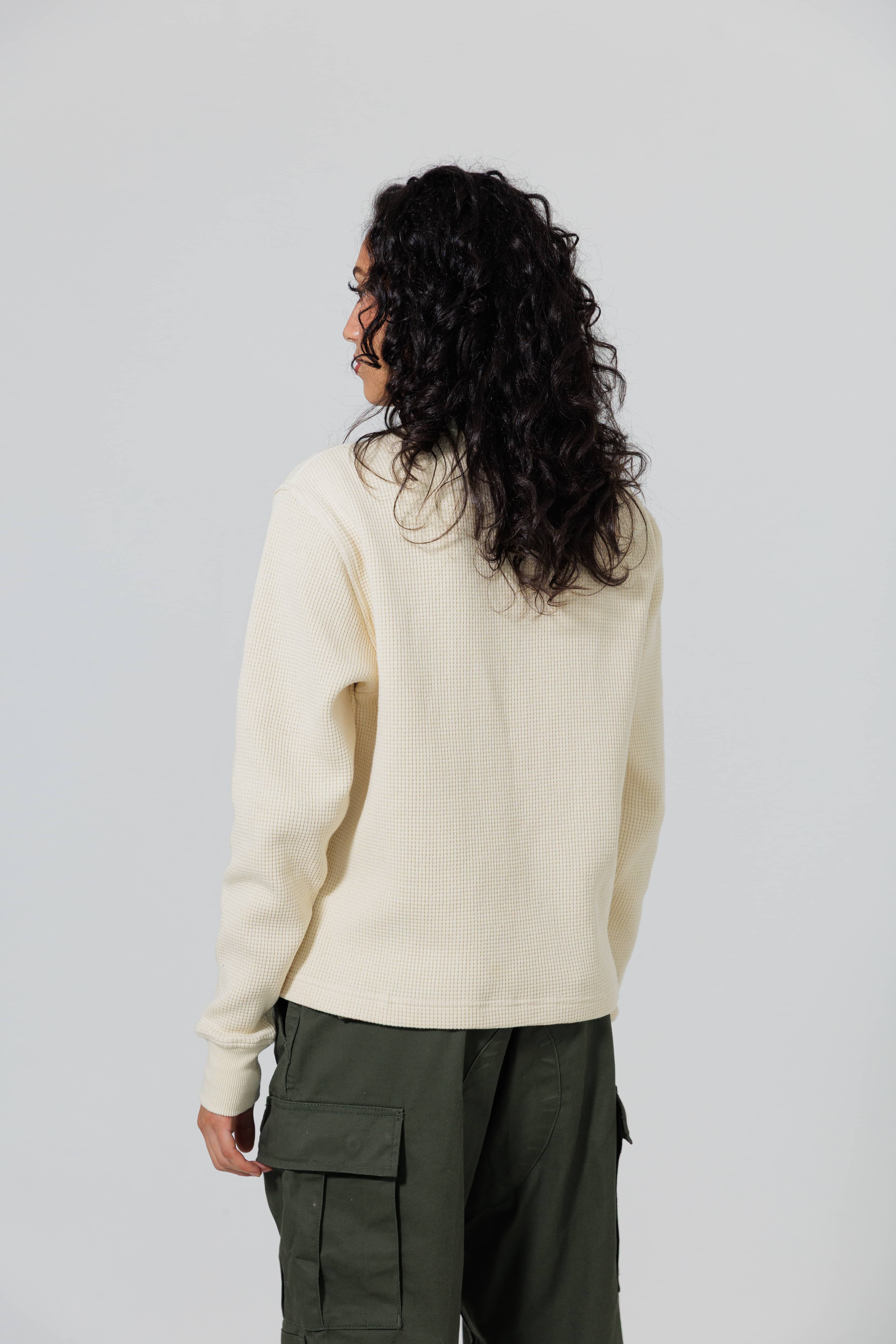 Rear view of a Female Model Wearing Cream Wisdom Of Age knit thermal
