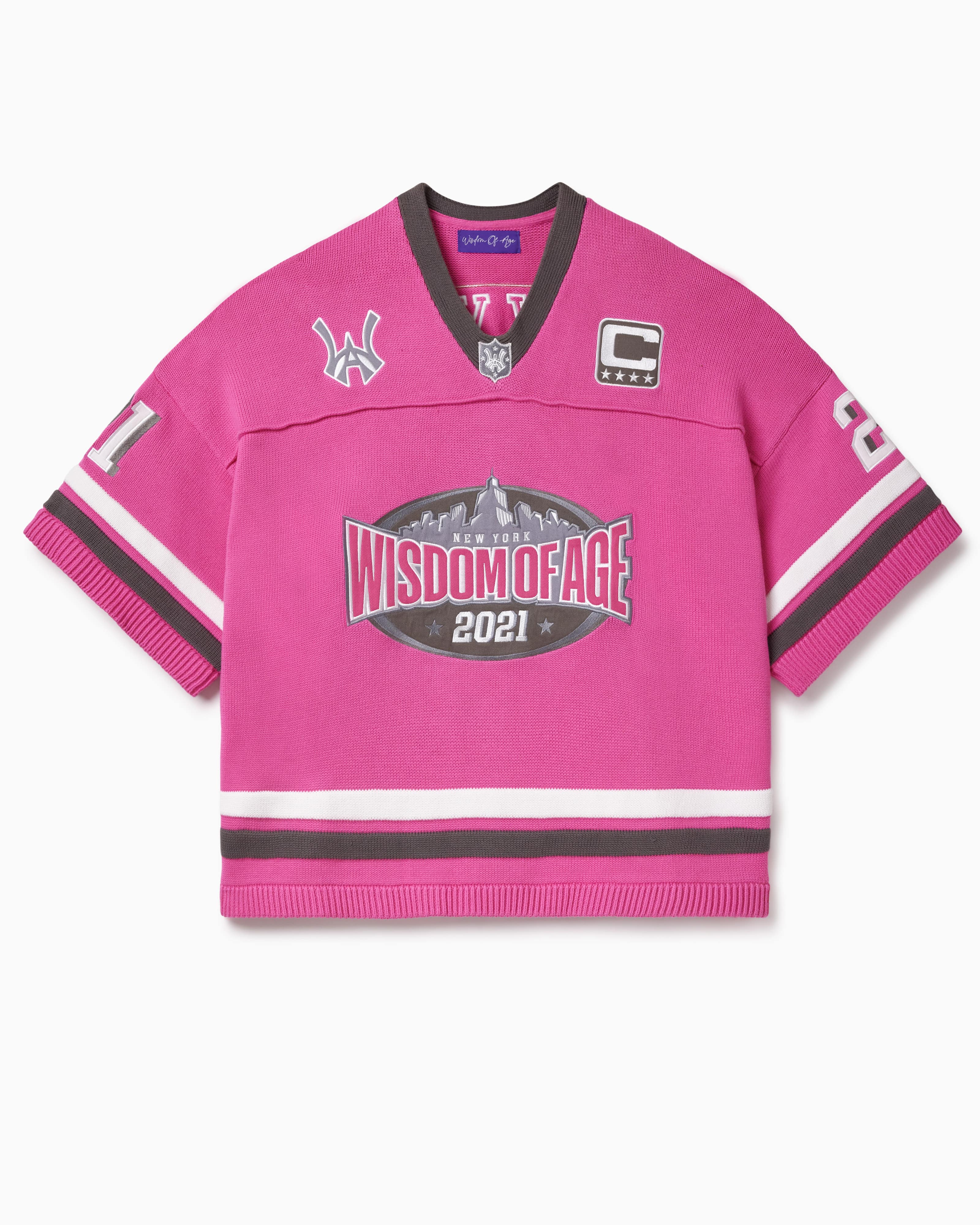 Pink knitted football  jersey with Wisdom Of Age skyline, WA logos anda captains patch.