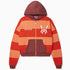 Front View Of the Wisdom Of Age Knit Zippered Hoodie. There are alternating horizontal orange stripes. One stripe is a darker shade of Orange. WA logo on left chest, Wisdom Of Age written in the signature font on the right chest. Kangaroo pockets separated by the zipper.