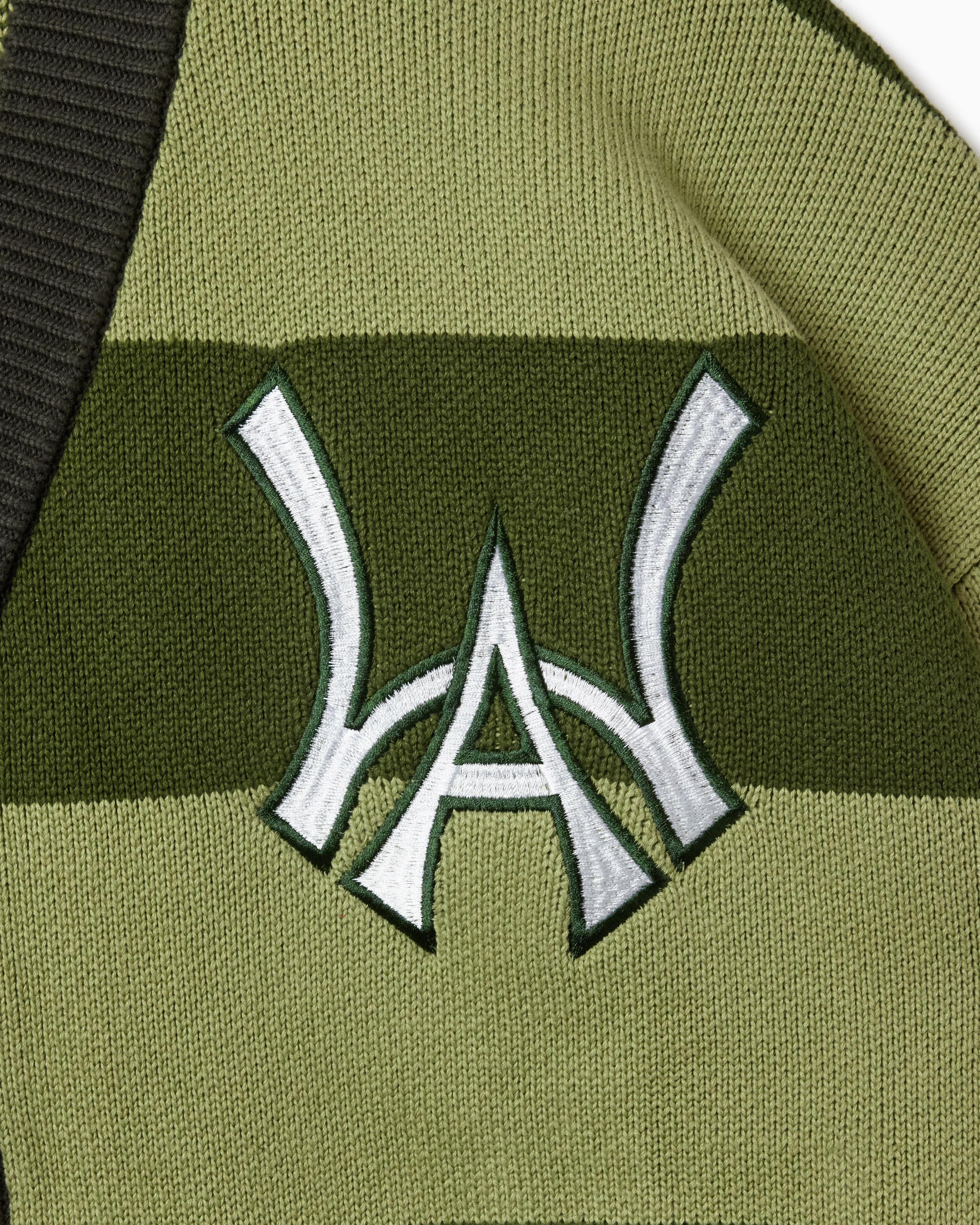 Wisdom of age 2024 olive green striped cardigan front logo
