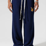 Genderless Model The Wisdom Of Age Knit Clinton Sweatpants Navy Front View.