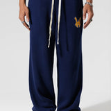 Genderless Model The Wisdom Of Age Knit Clinton Sweatpants Navy Front View.