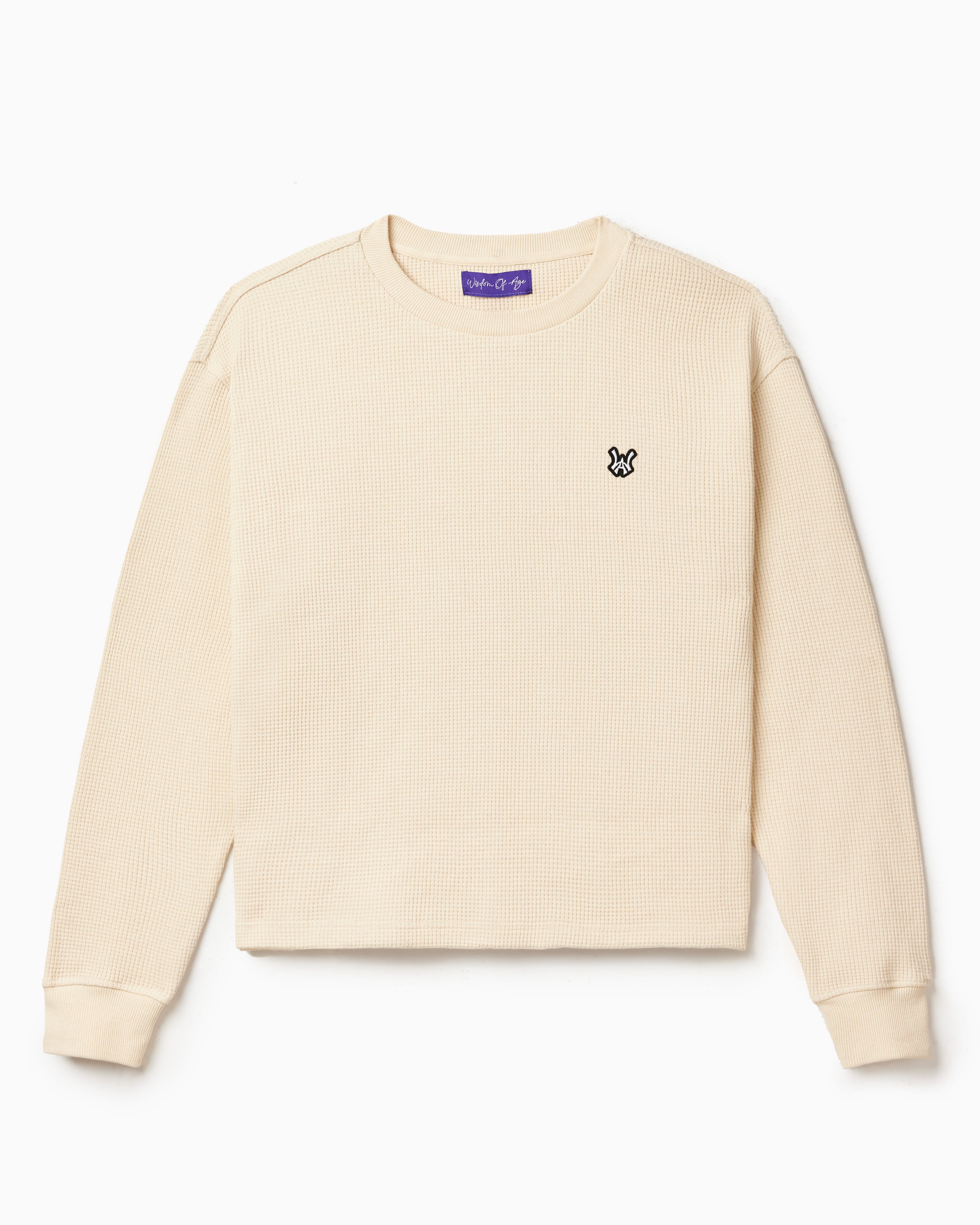 Front view of the Wisdom Of Age knit thermal shirt in cream. WA logo embroidered on the left chest.
