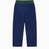 The Wisdom Of Age Knit Clinton Sweatpants Navy Rear View with a dark green waistband.