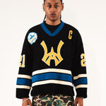 Male Model wearing WOA Hockey Jersey - Static Shock with a yellow WA logo and camouflage pants on a white background