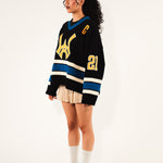Side View of a Female model Wearing The Wisdom Of Age Hockey Jersey - Static Shock