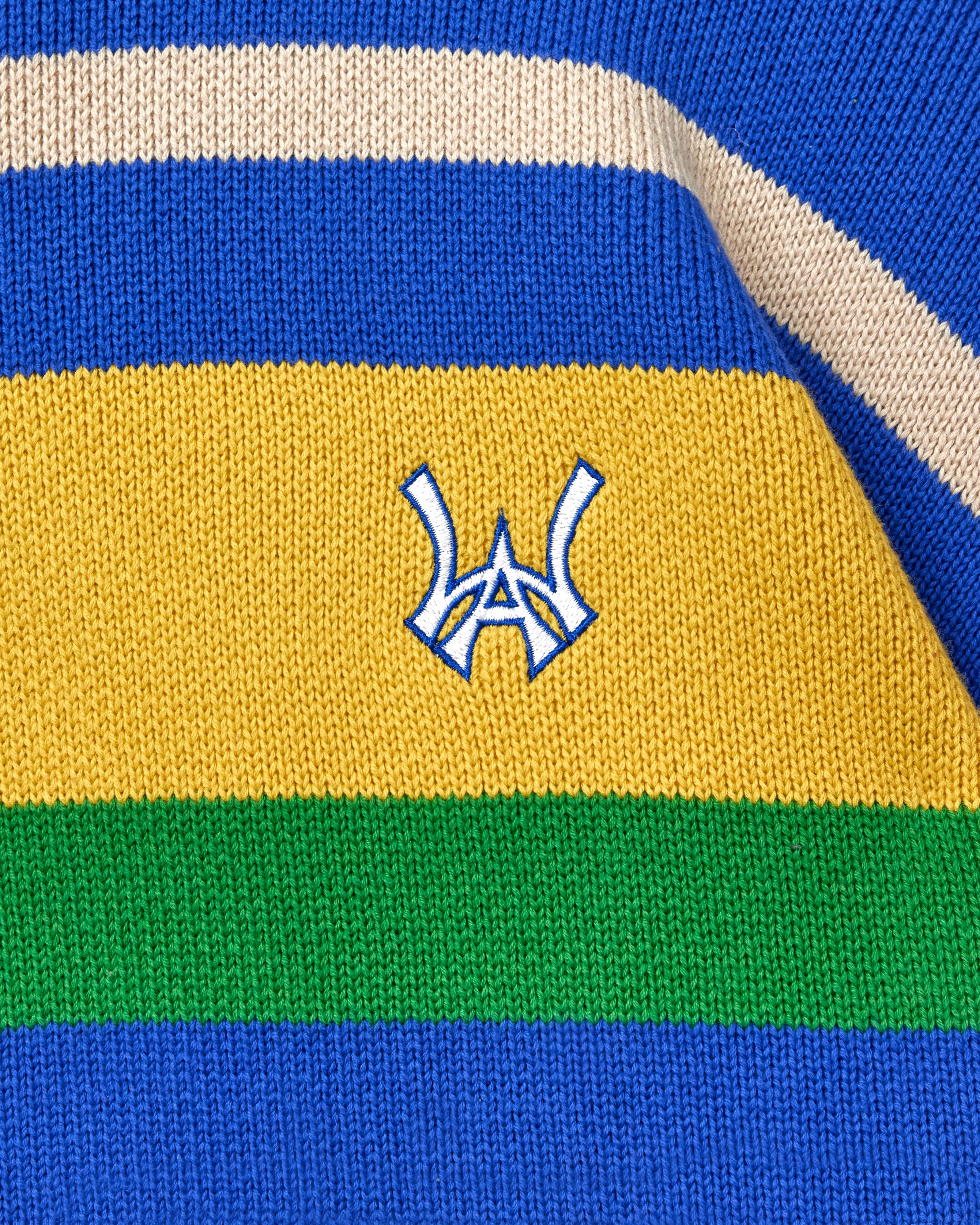 Close-up of a multicolored fabric with the WA logo in the center