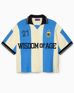 Wisdom Of Age Knit Soccer Jersey Celeste. Blue and beige striped Knitted Soccer Jersey with 'Wisdom of Age' text on a white background