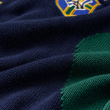 Close-up of a navy and green Wisdom Of Age Knit Soccer Jersey Rio with a WA logo in the top right corner.