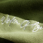 Wisdom of age 2024 olive green striped cardigan front script logo