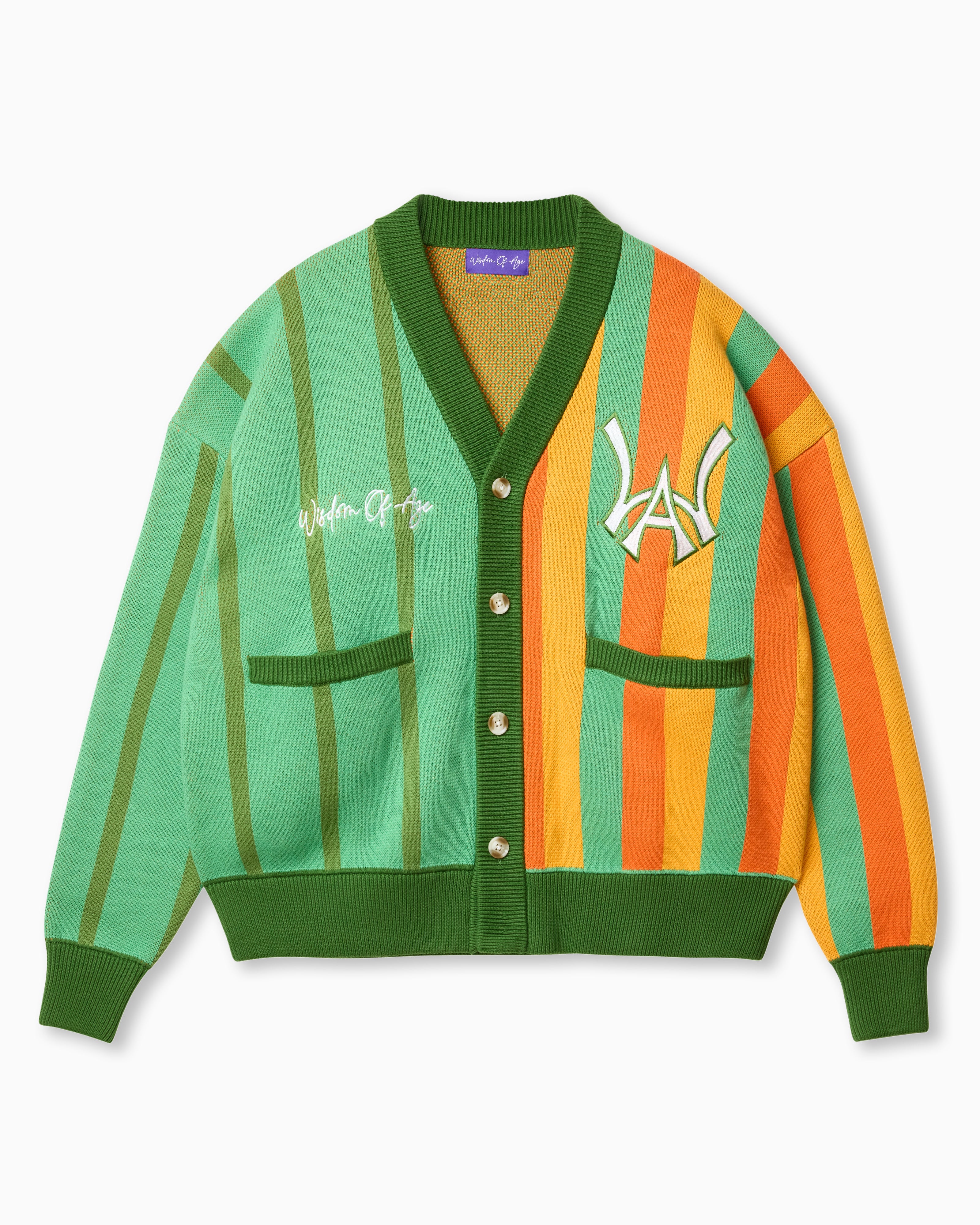 Wisdom of Age Orange and Mint Green Vertical Striped City Cardigan. A color blend of oranges and mint green with a symmetrical split of greens on the right side and a blend of oranges with some green on the left. The WOA symbol on the top left side of the chest and the brand name “Wisdom of Age” written in script cursive on the upper right chest. Two drop-in slip pockets on both sides and a 4 button placket with a v-neck drop.