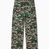 Camouflage pants with a WA logo on a white background
