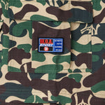 Camouflage fabric with the W.O.A  patch on a pocket