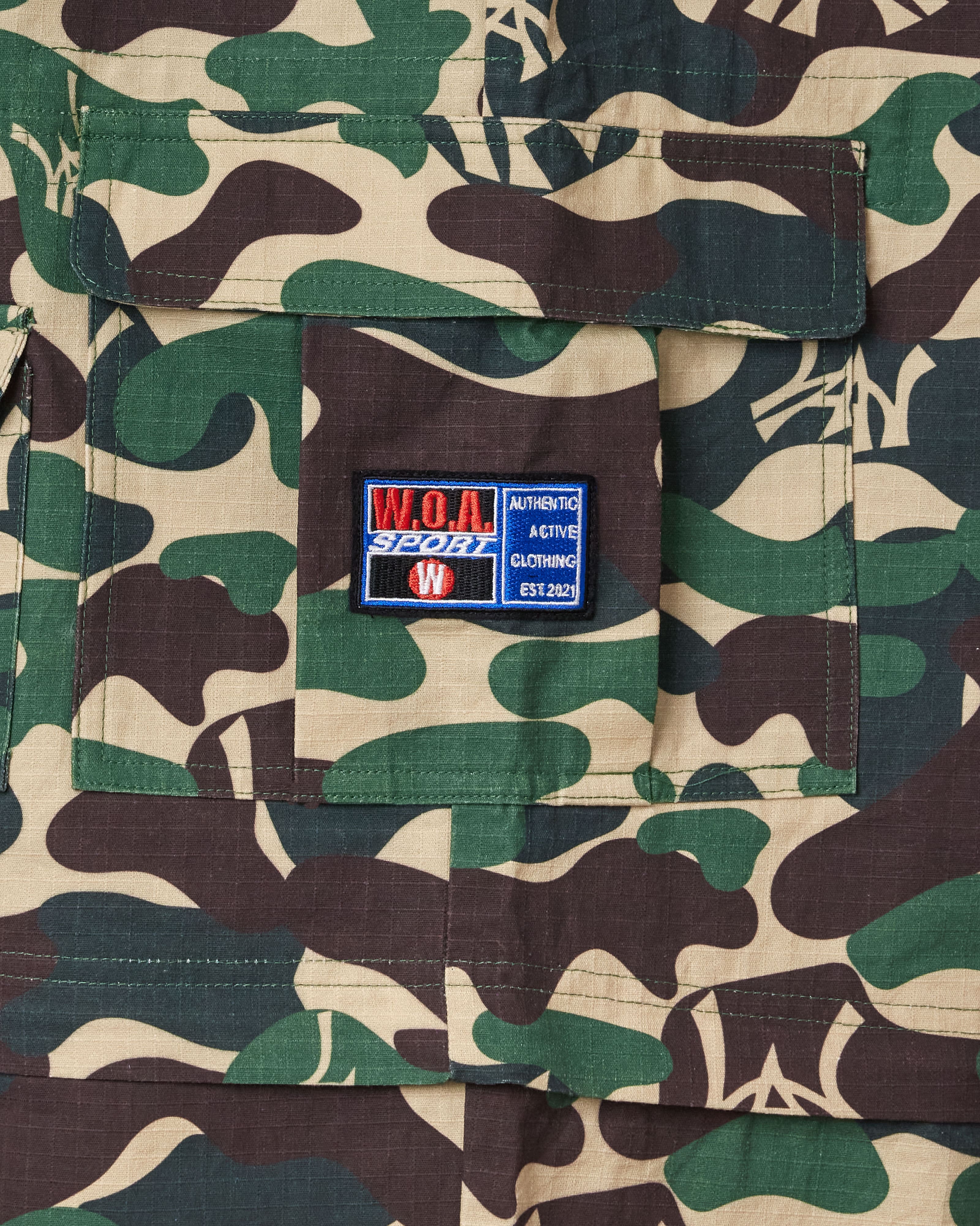 Camouflage fabric with the W.O.A  patch on a pocket