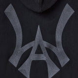 Closer look at the brand logo in a monogram font of connecting the "W" and "A" located on the middle back of the hoodie.
