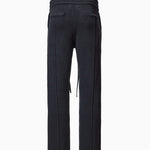 Back of Wisdom of Age Knit Sweatpants in Black. Back welt pockets and WA logo chain stitched below back right pocket on the side.