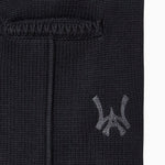 Closer look at the brand logo in a monogram font of connecting the "W" and "A" located below the right back pocket on the right leg.