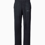 Wisdom of Age Knit Sweatpant in Black. Waffle knit texture with drawstrings elasticized waistband. Side slip-in pockets and script brand name embroidered on front left leg.