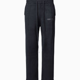 Wisdom of Age Knit Sweatpant in Black. Waffle knit texture with drawstrings elasticized waistband. Side slip-in pockets and script brand name embroidered on front left leg.