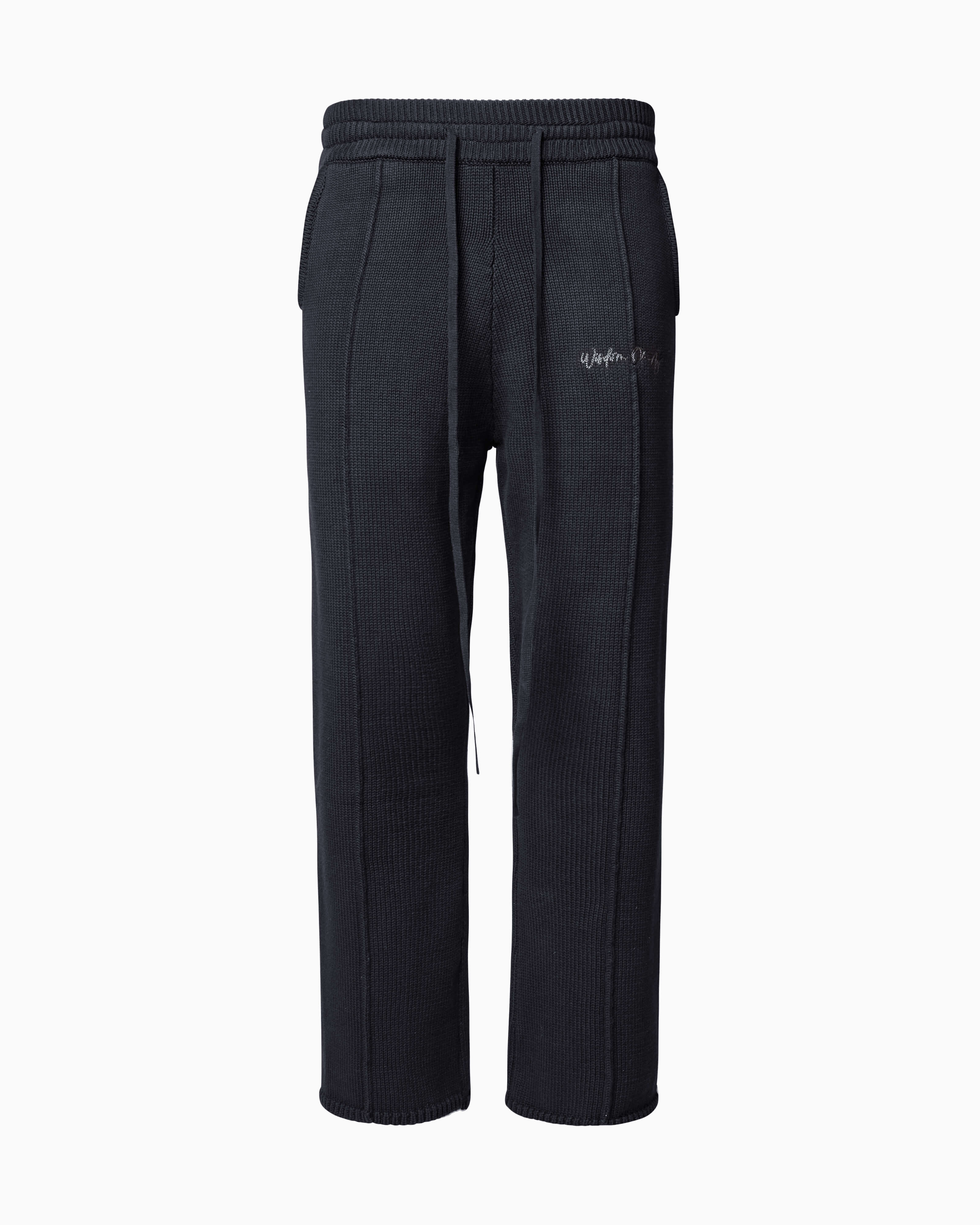 Wisdom of Age Knit Sweatpant in Black. Waffle knit texture with drawstrings elasticized waistband. Side slip-in pockets and script brand name embroidered on front left leg.