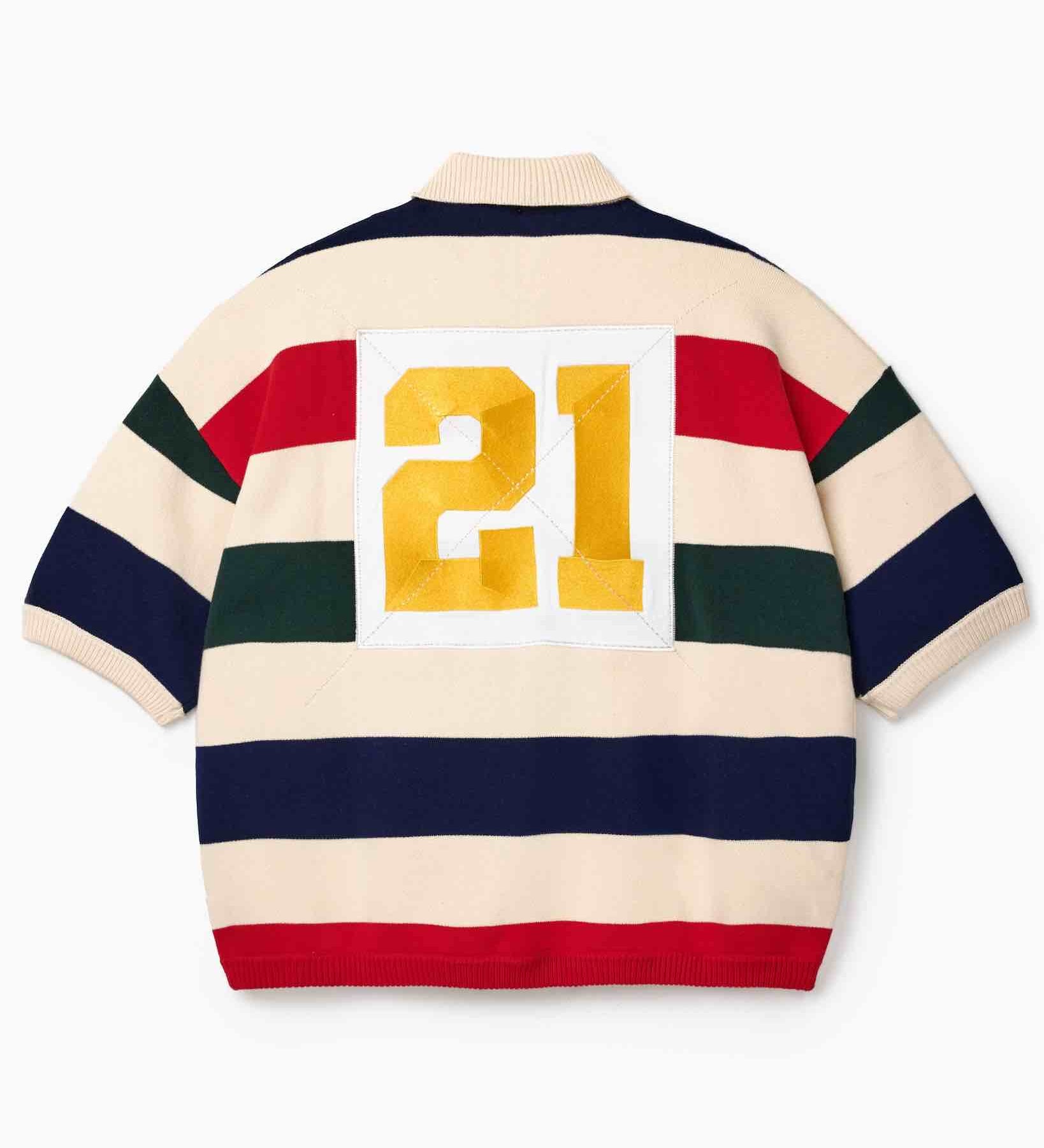 Wisdom of Age Bleecker Rugby Polo in multicolor stripes back view with gold embroidered 21 patch on white background.