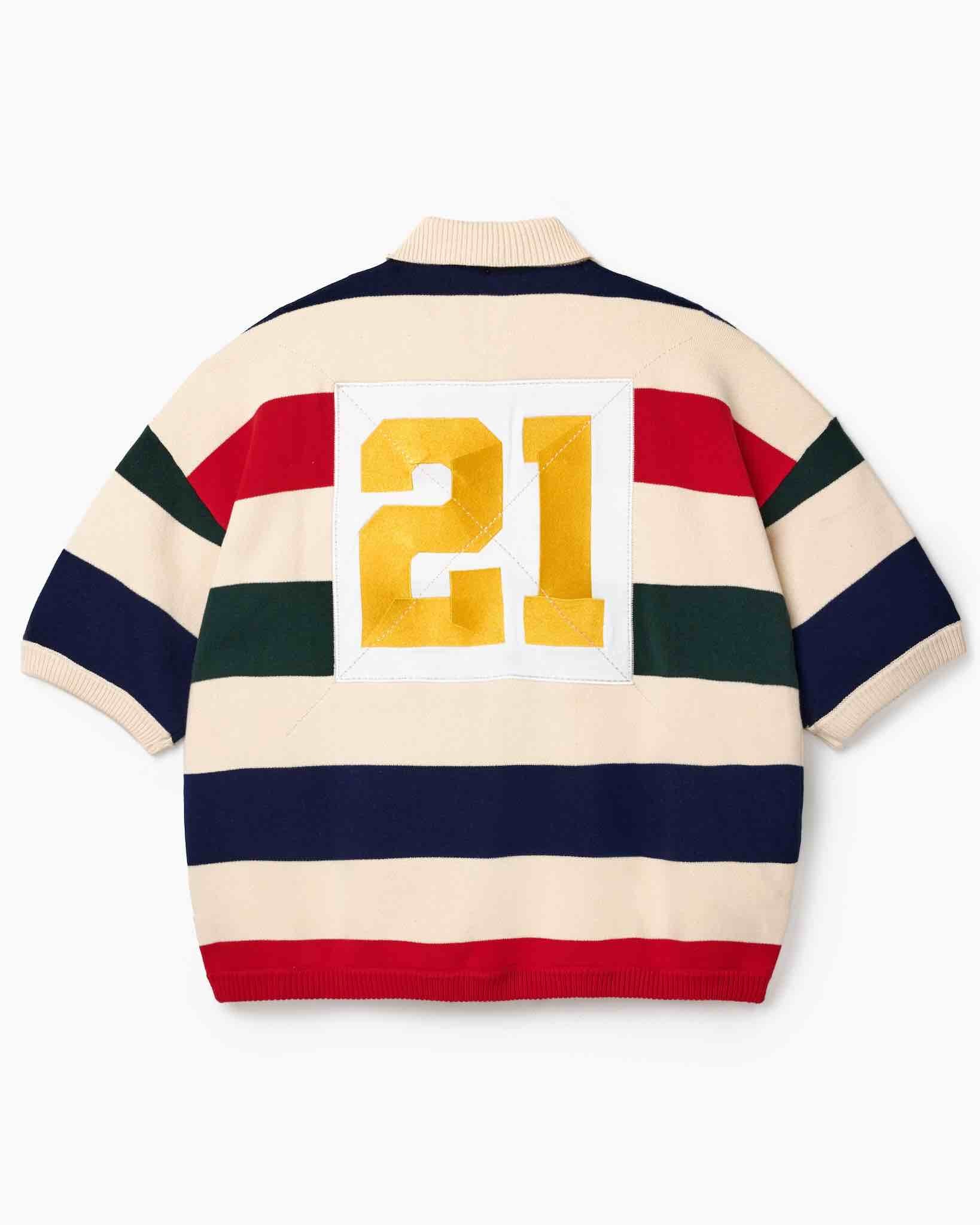 Wisdom of Age Bleecker Rugby Polo in multicolor stripes back view with gold embroidered 21 patch on white background.