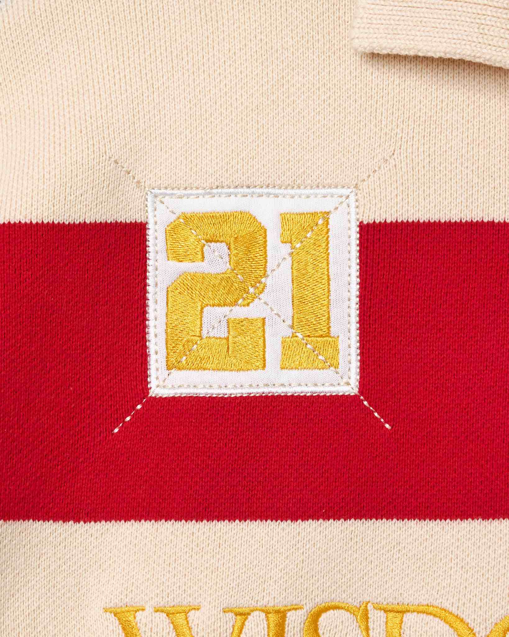 Wisdom of Age Bleecker Rugby Polo in multicolor stripes zoomed front view of embroidered 21 .