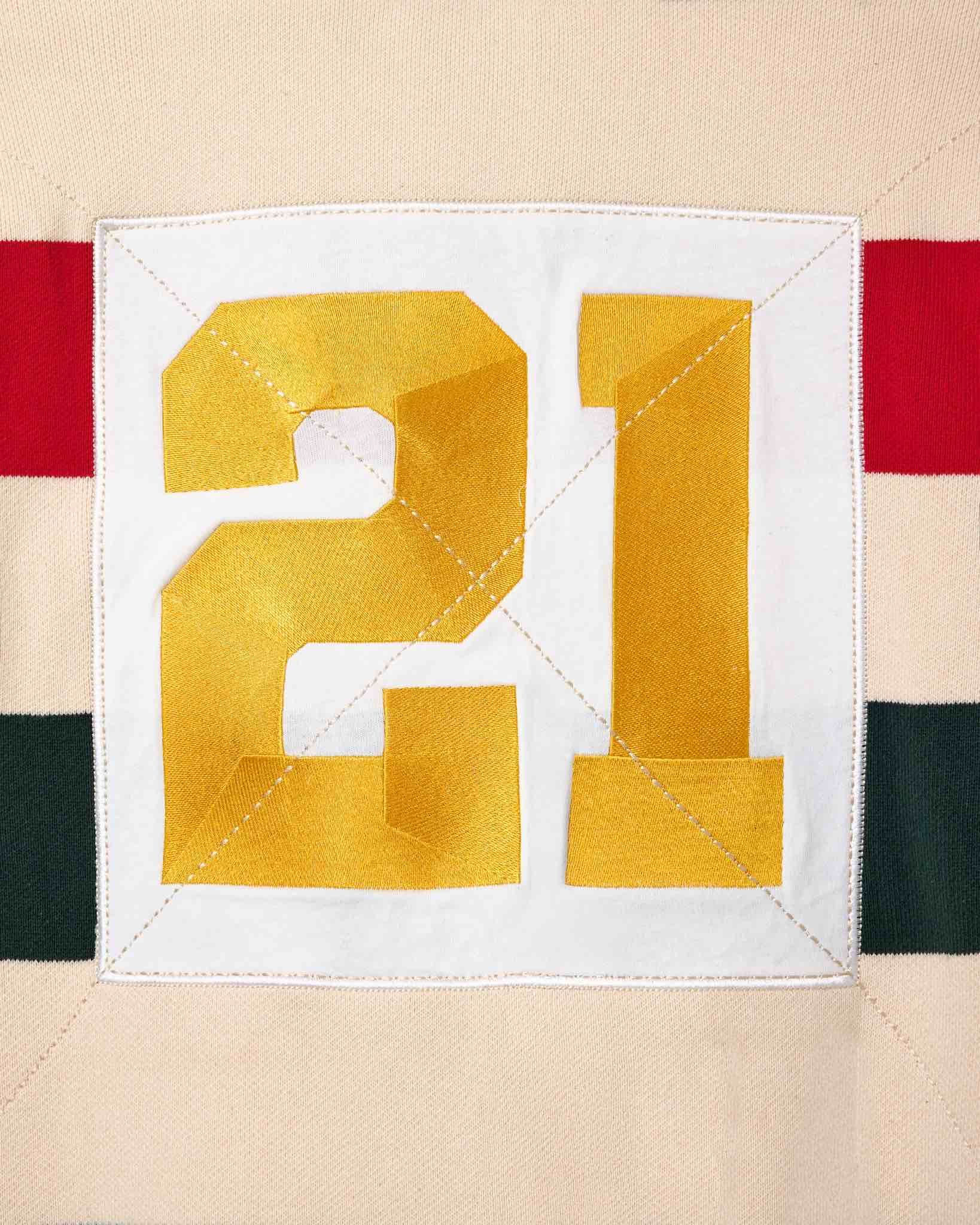 Wisdom of Age Bleecker Rugby Polo in multicolor stripes zoomed back view of embroidered 21 .